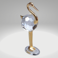 Broušená skleněná figurka se zlacenými kovovými prvky Volavka